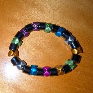Metallic bracelet that is stretchy.